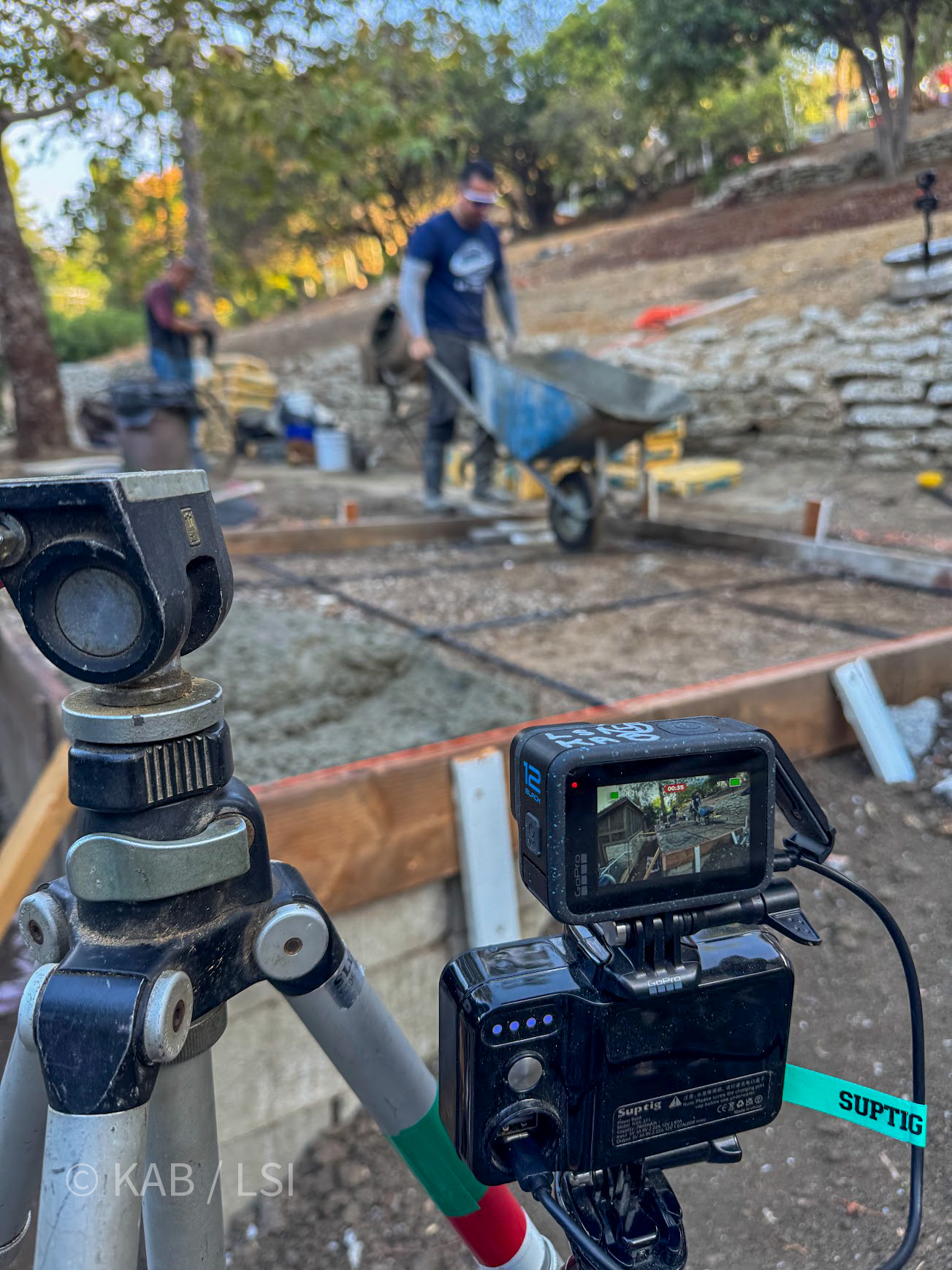 Keith filming the concrete pour with GoPro on tripod